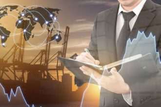 A businessman reviews financial data and global logistics, highlighting the need for vet sector adaptability.